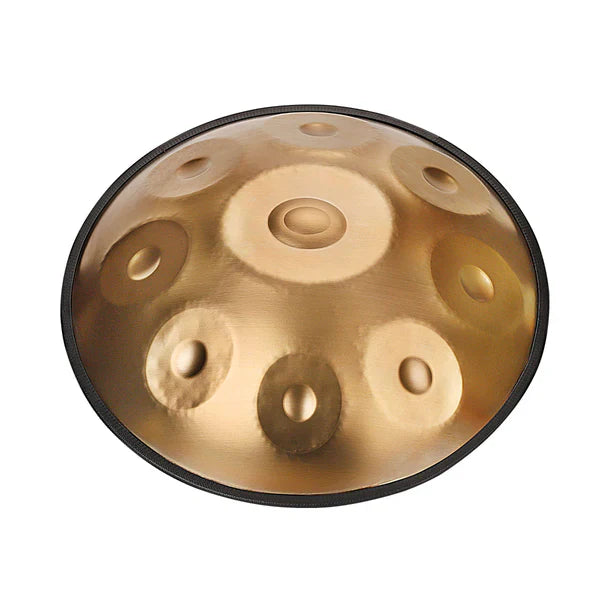 Close-up side view of a golden handpan with detailed craftsmanship