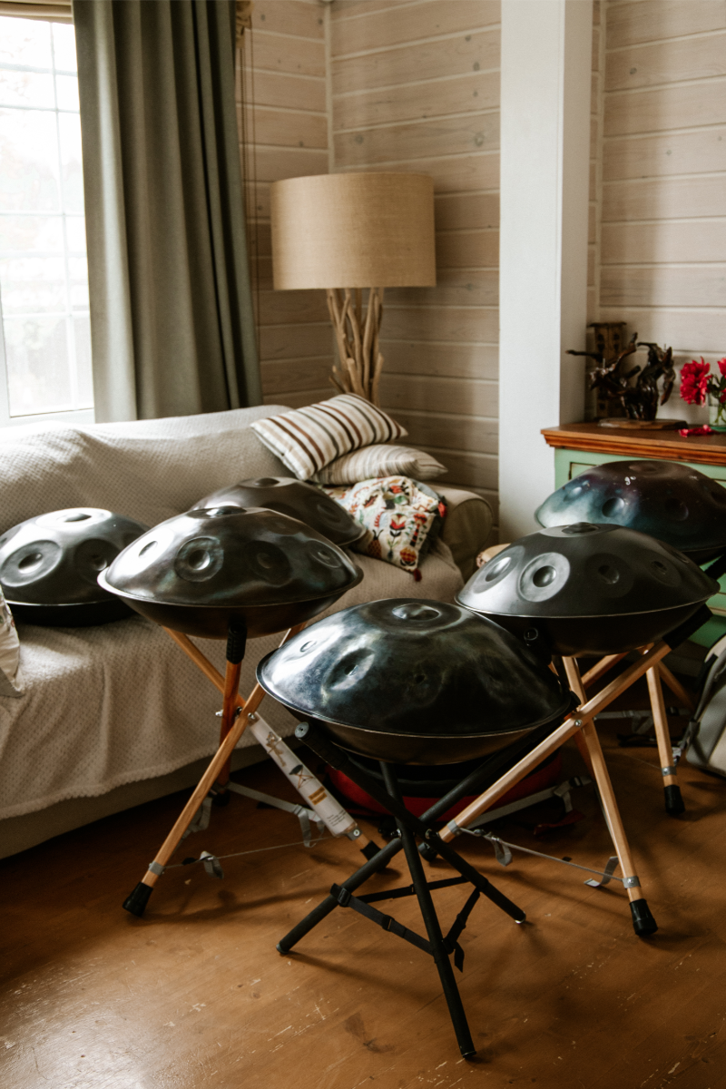 Collection of handpans with different designs placed indoors