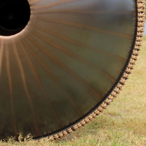 A detailed view showcasing the craftsmanship on the underside of a handpan