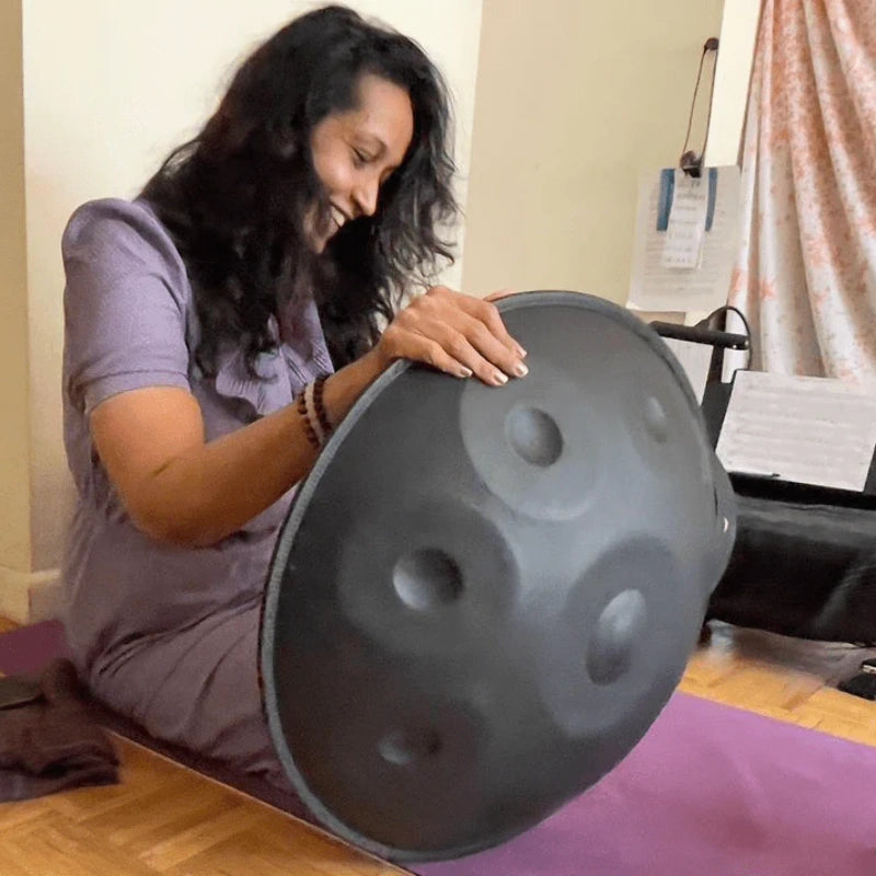 Grateful musician holding a newly received handpan