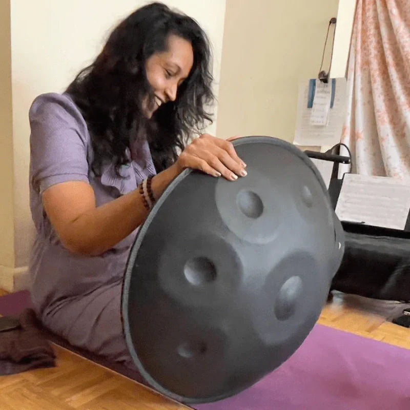 Grateful musician holding a newly received handpan