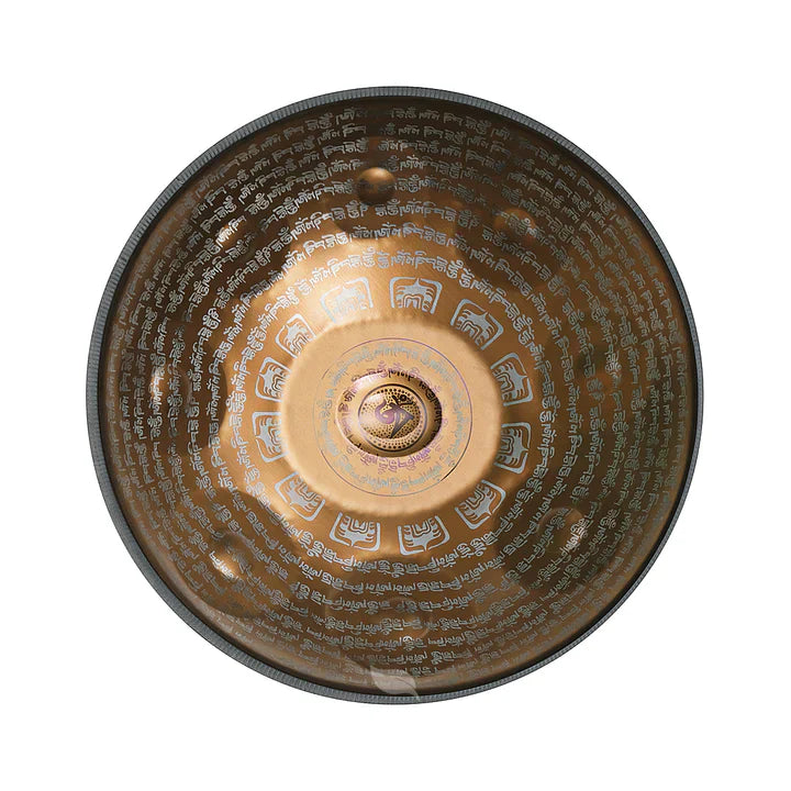 A golden handpan engraved with Tibetan script.