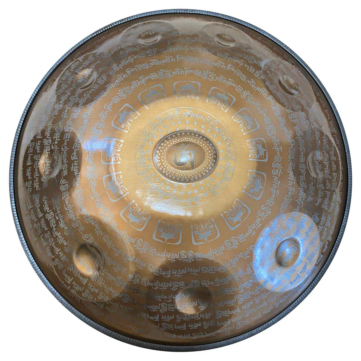A luminous Cosmoshandpan handpan in gold finish, etched with Tibetan script for meditative sound journeys.