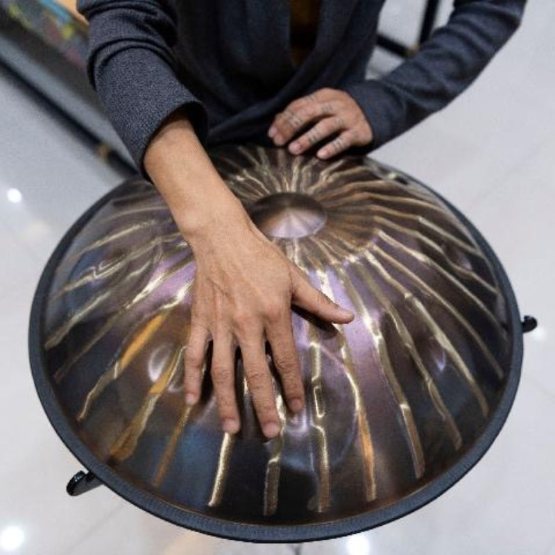 Musicians playing handpan pan drum indoors