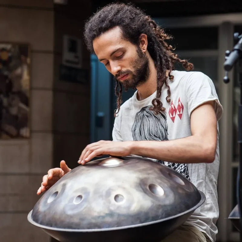 Musicians showcasing handpan playing techniques