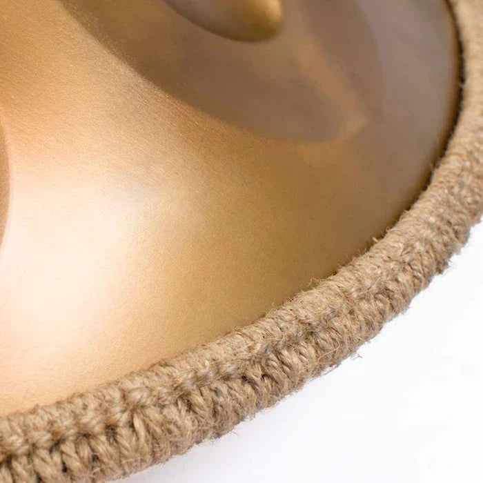 Close-up detail of the gold hand pan drum