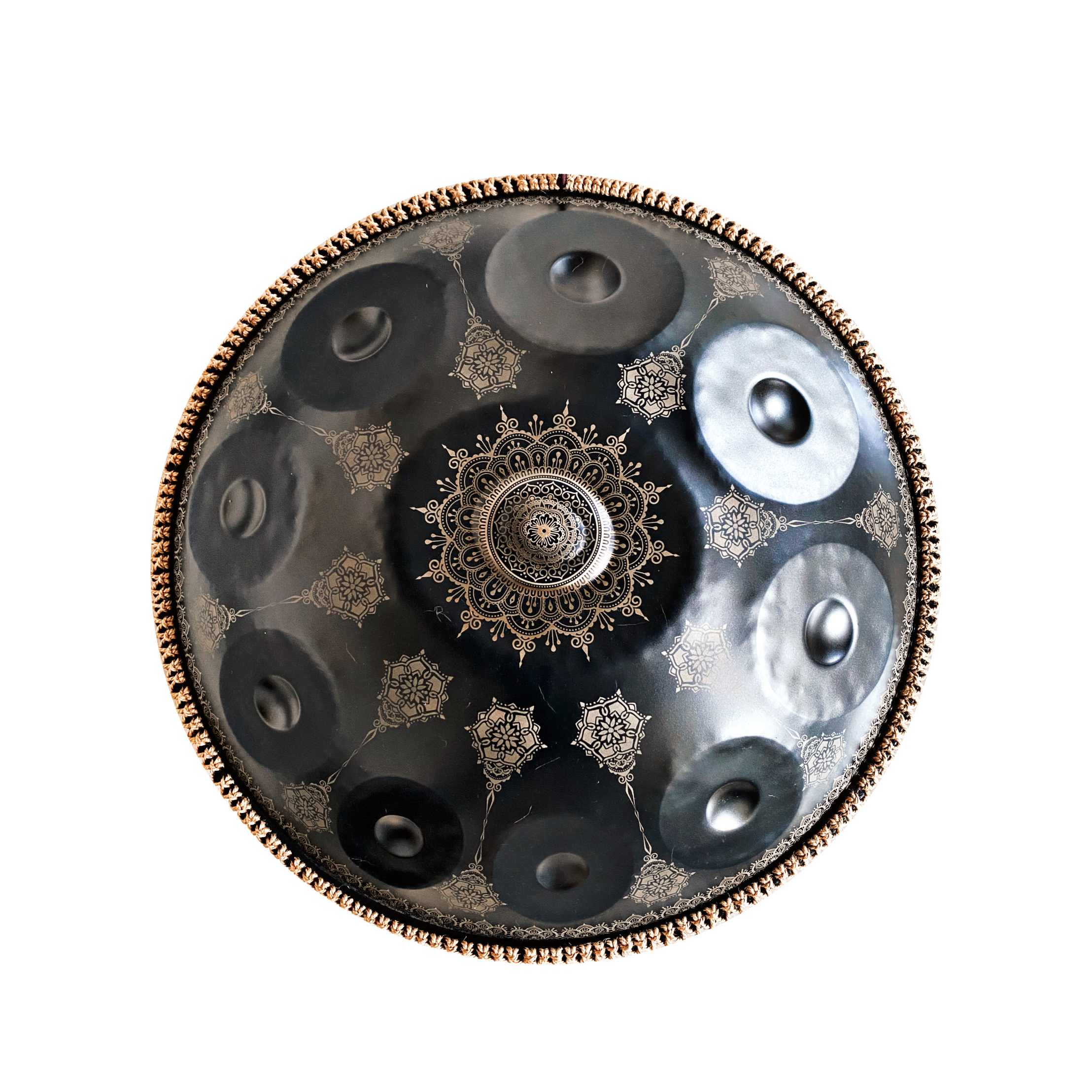 Black handpan displaying artistic pattern design