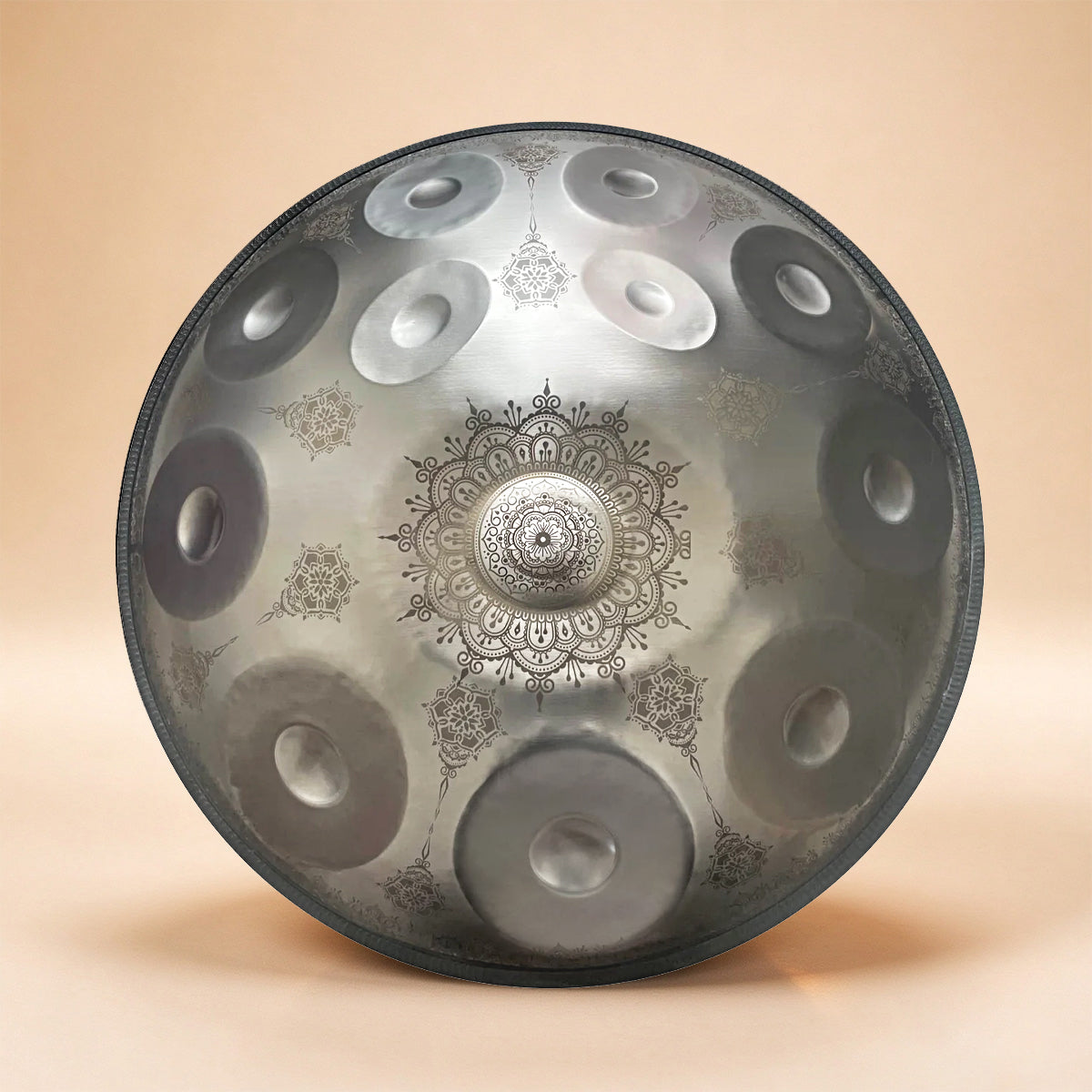Handpan instrument in stunning Silver color, accented by floral patterns
