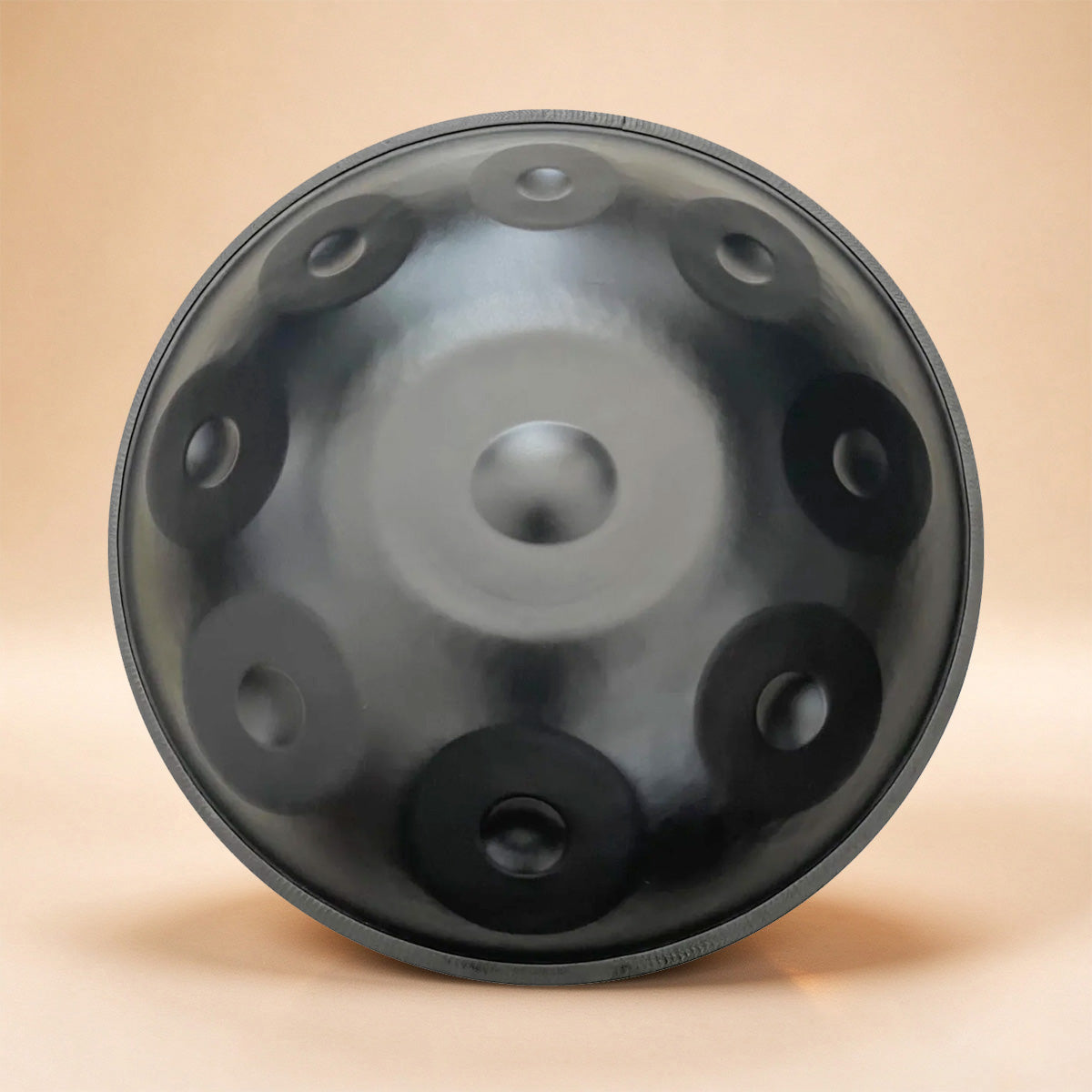 Handpan instrument with black powder coating
