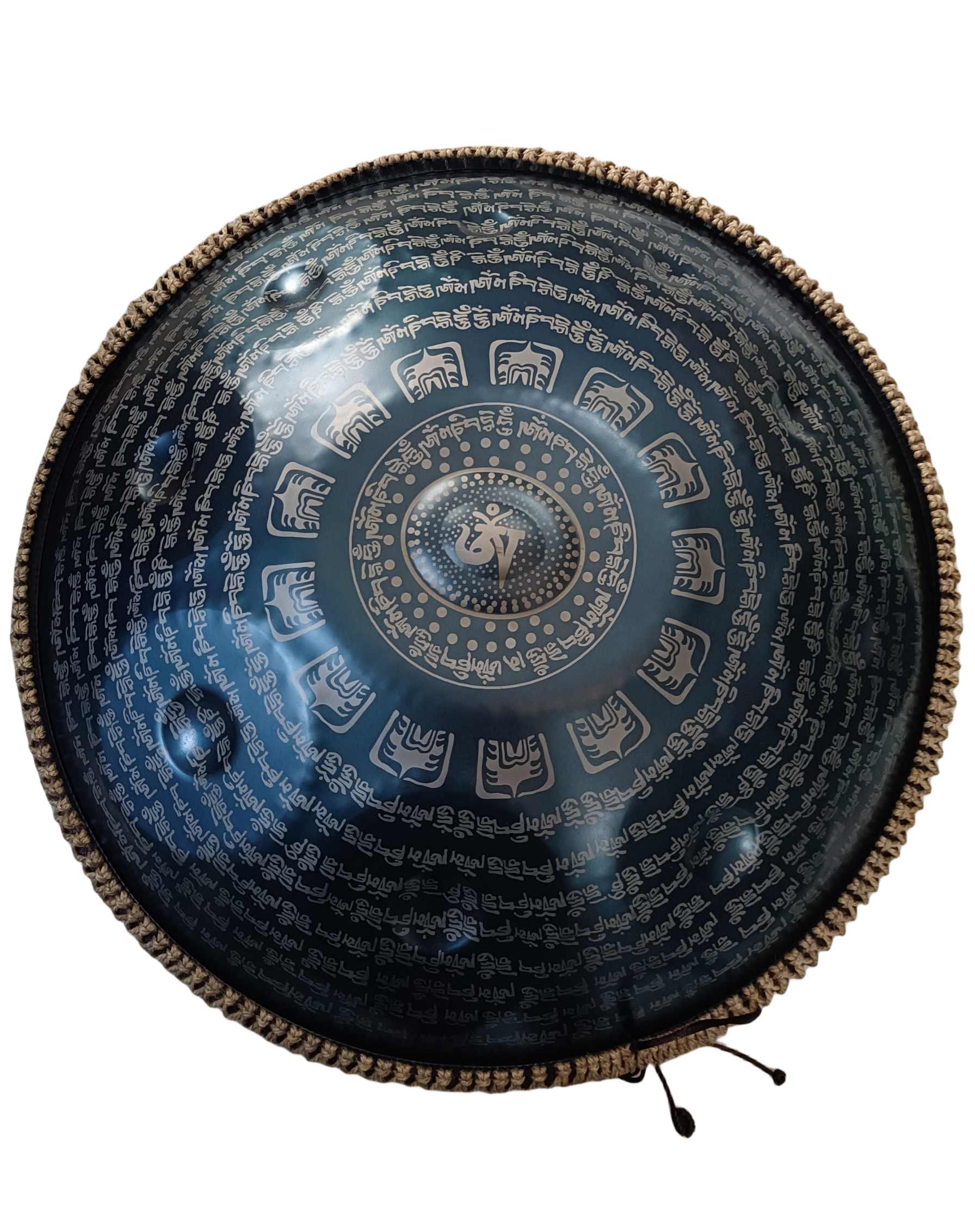 Handpan displaying detailed Tibetan script craftsmanship