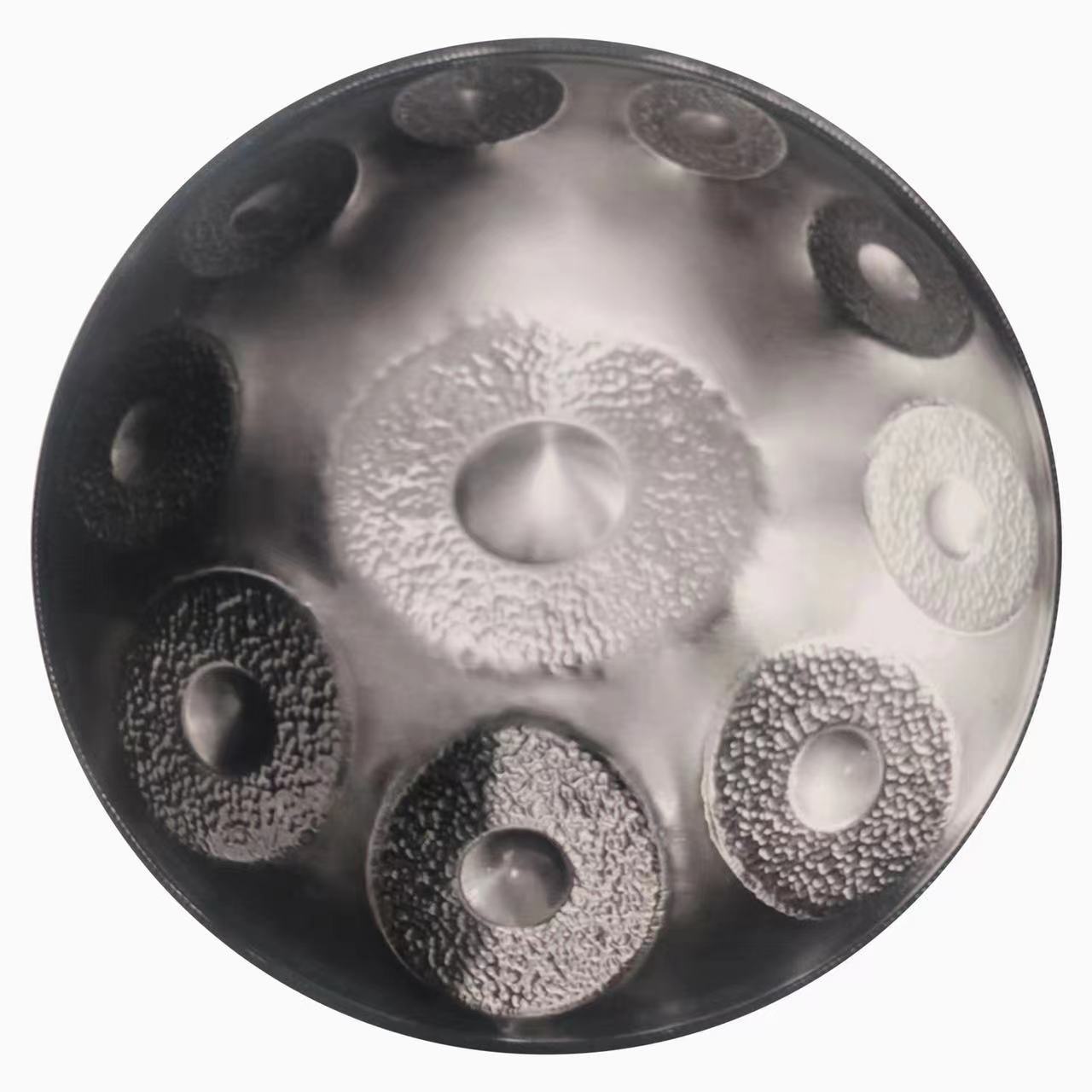 Hand-forged Silver handpan featuring intricate handcrafted details