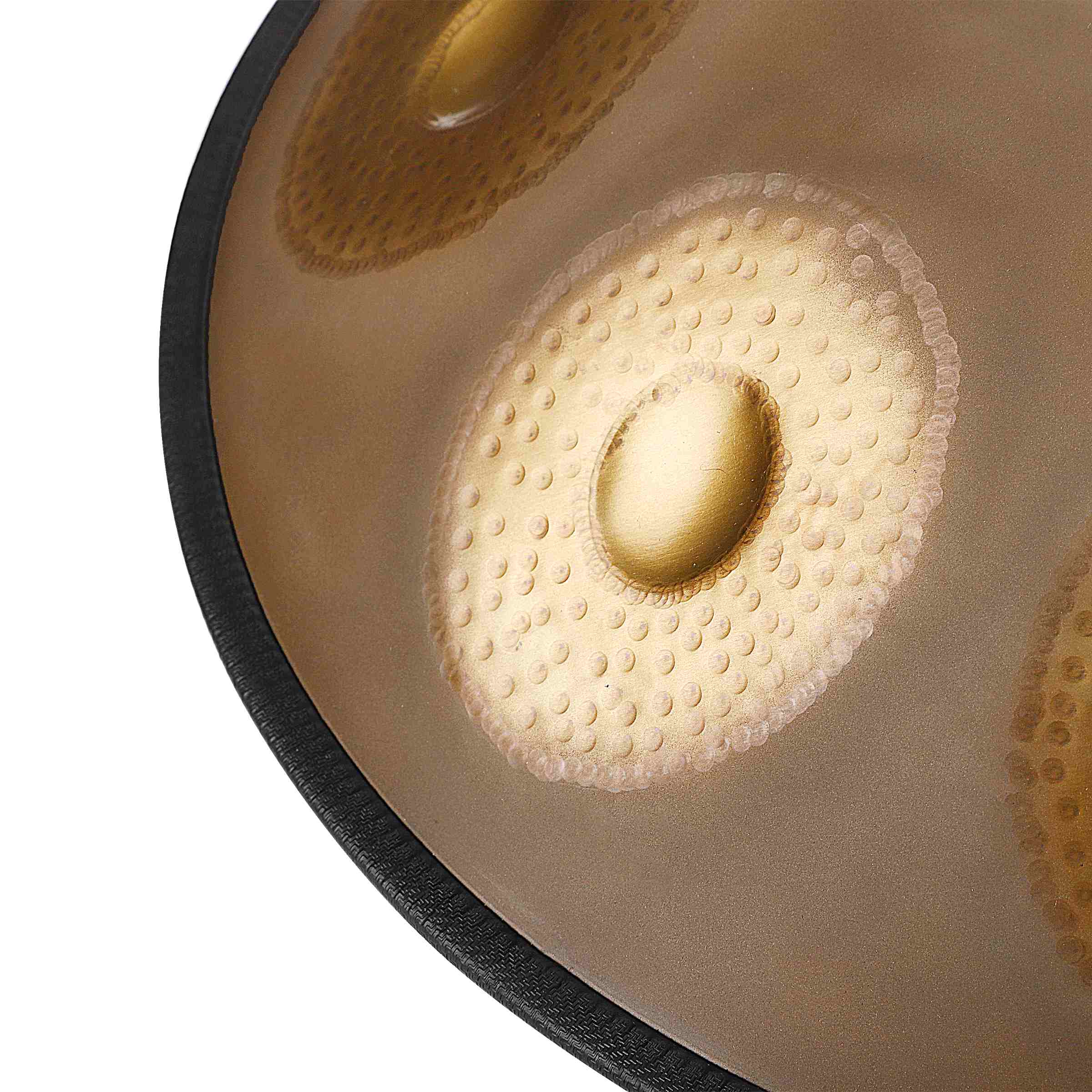 Close-up of a shimmering Gold hand-forged handpan drum